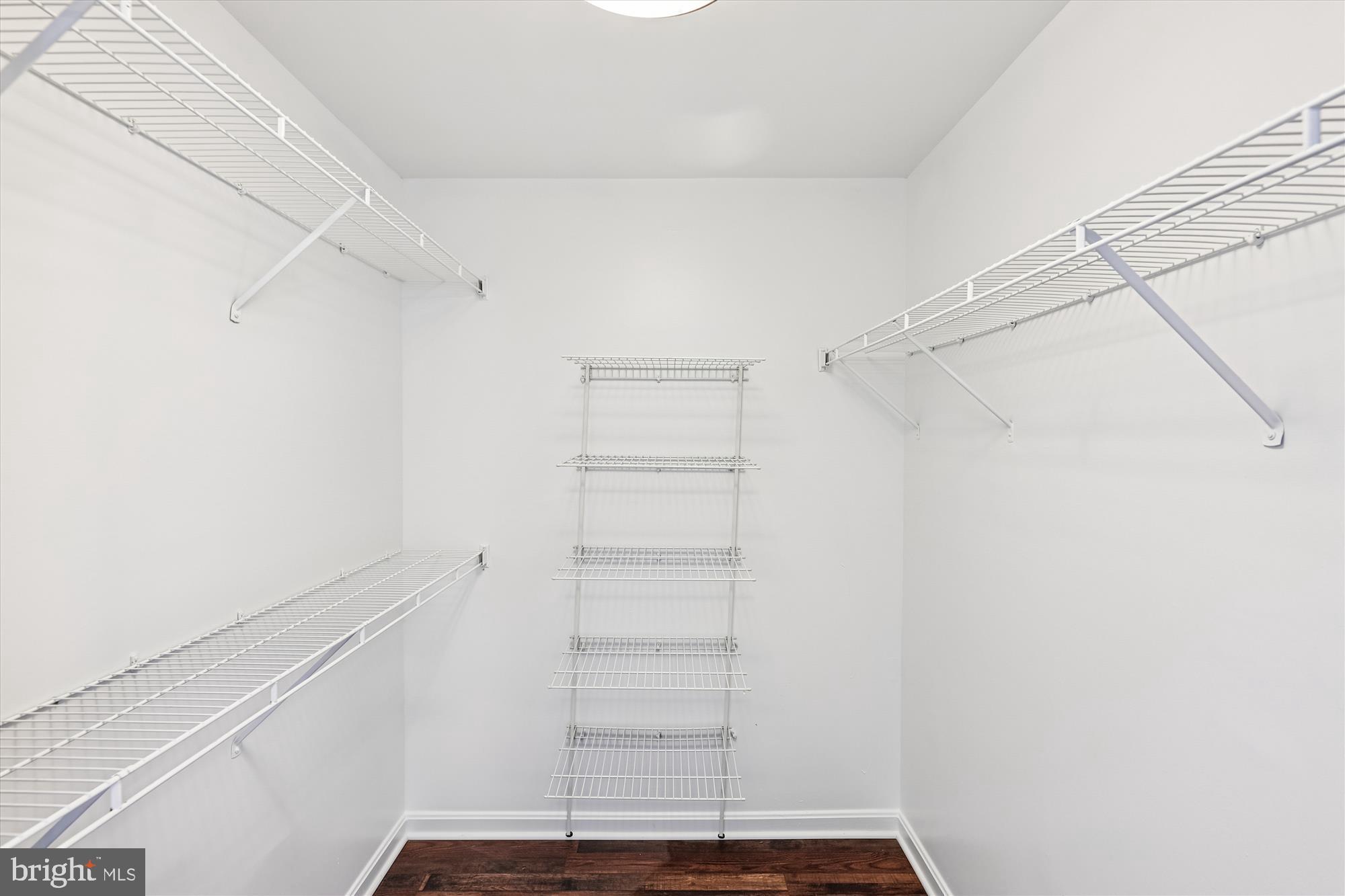 3811 Eisenhower Avenue Alexandria, VA 22304 - Photo 27 of 56 a view of walk in closet with empty racks