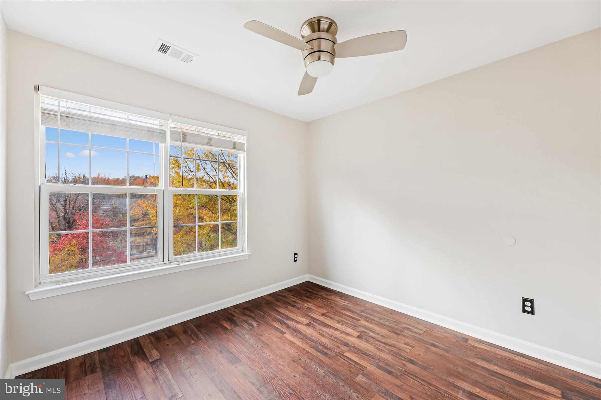 3811 Eisenhower Avenue Alexandria, VA 22304 - Photo 32 of 56 a view of empty room with wooden floor and fan