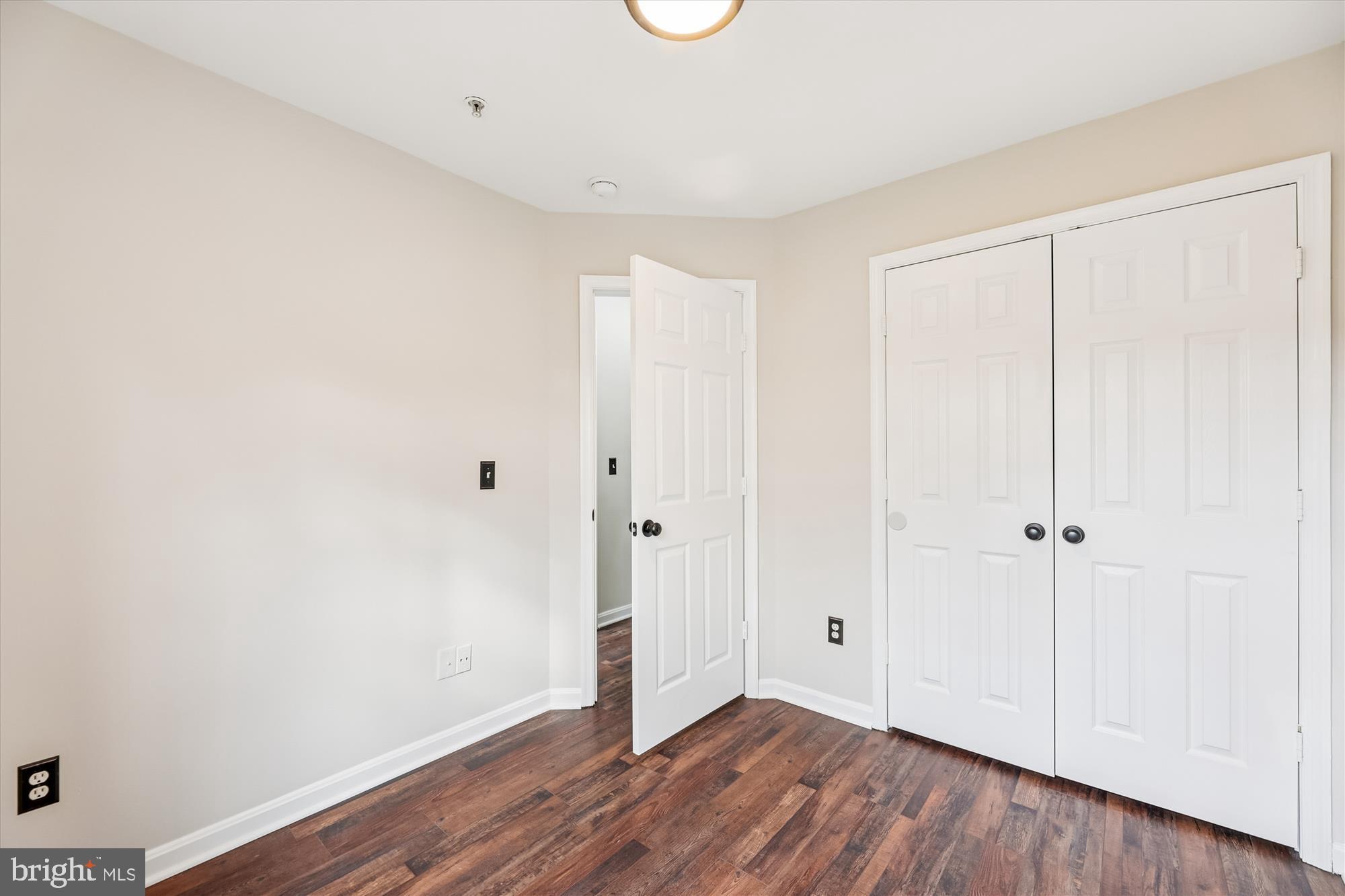 3811 Eisenhower Avenue Alexandria, VA 22304 - Photo 33 of 56 a view of an empty room with wooden floor