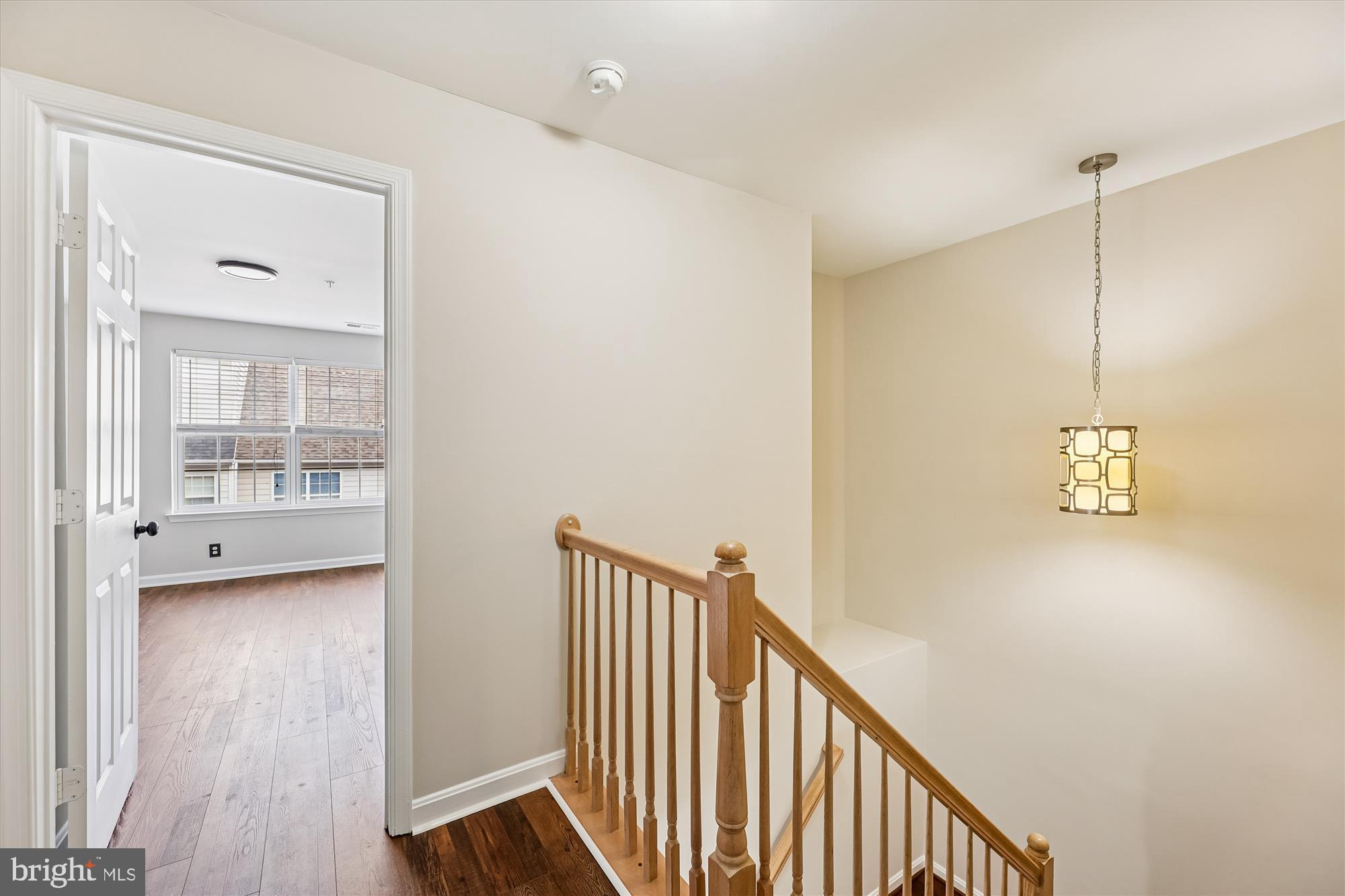 3811 Eisenhower Avenue Alexandria, VA 22304 - Photo 36 of 56 a view of a hallway with wooden floor and a bathroom