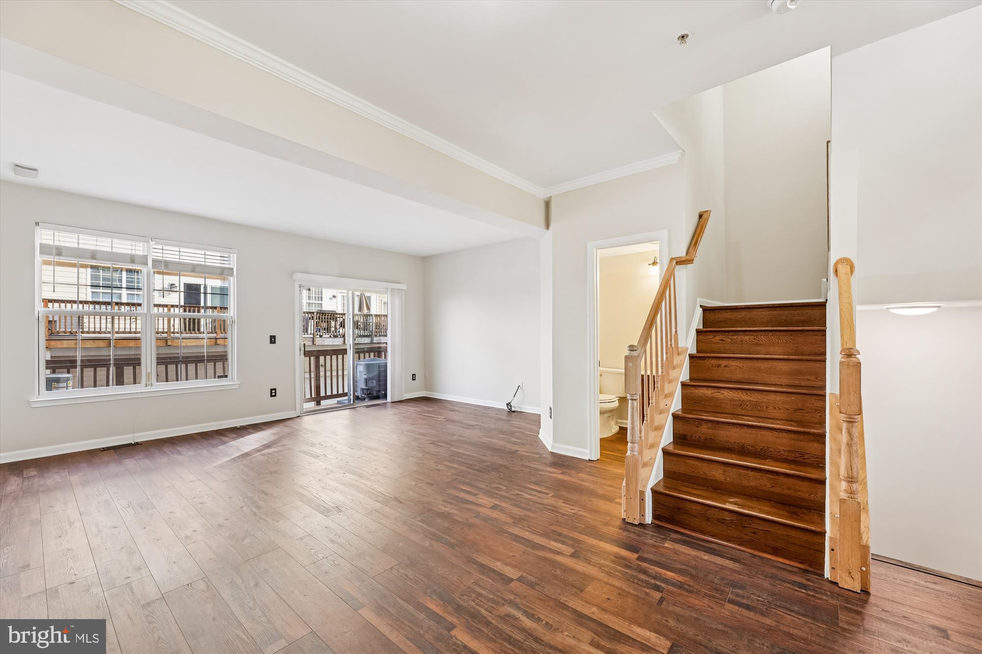 3811 Eisenhower Avenue Alexandria, VA 22304 - Photo 7 of 56 wooden floor in an empty room with a window