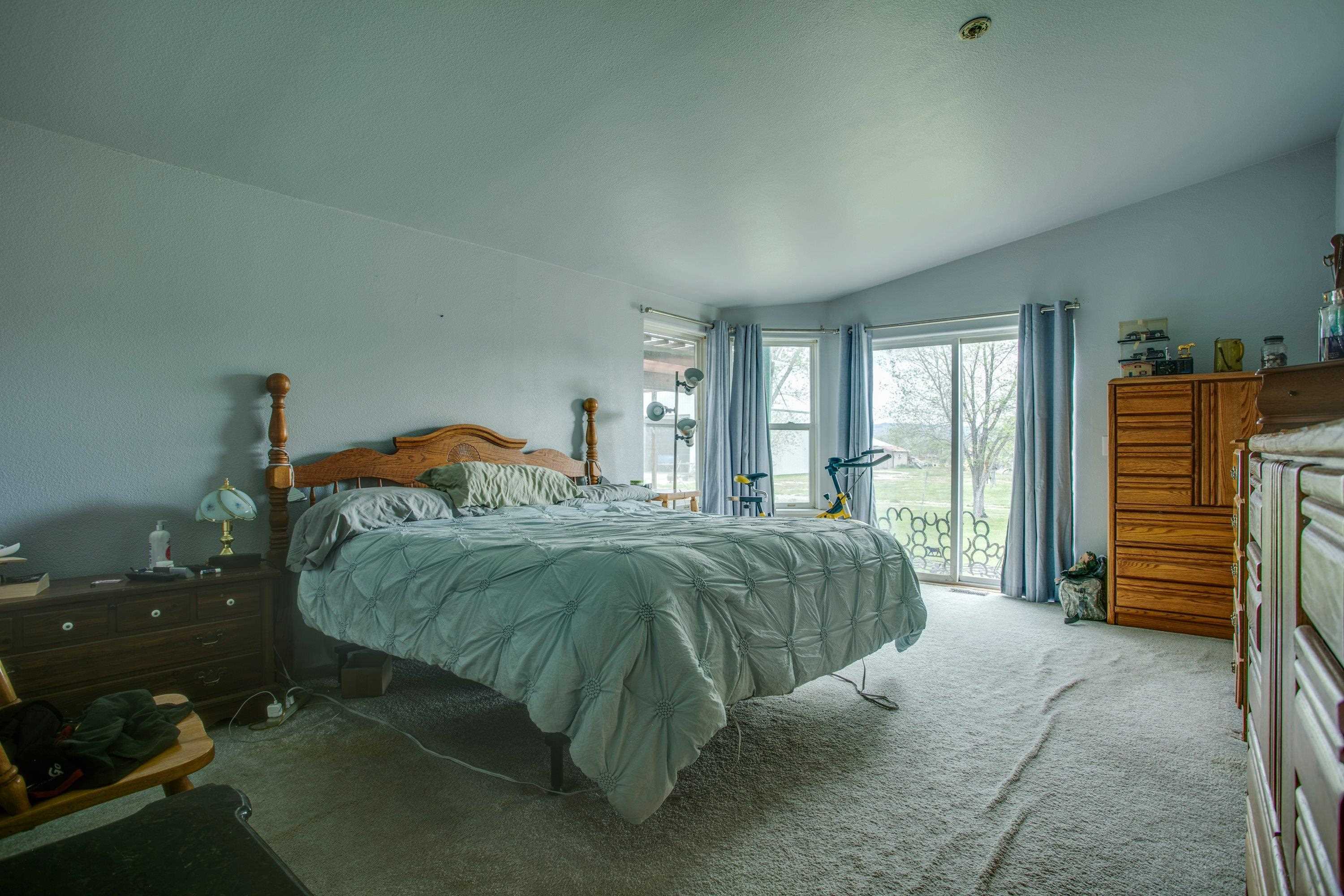1951 I-70 B Frontage Road De Beque, CO 81630 - Photo 15 of 19 a bedroom with a bed and a closet