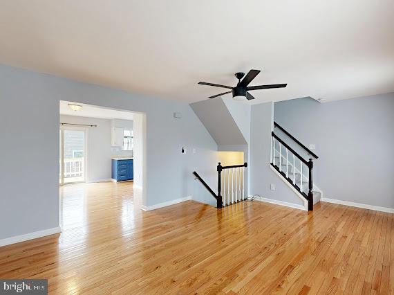 8 Rutherford Place Harpers Ferry, WV 25425 - Photo 2 of 33 a view of an empty room with wooden floor and a ceiling fan