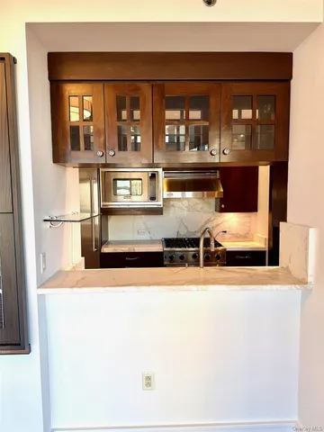 a view of living room with furniture and window