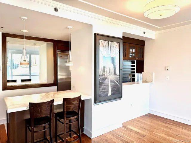 a view of a dining room with furniture and window