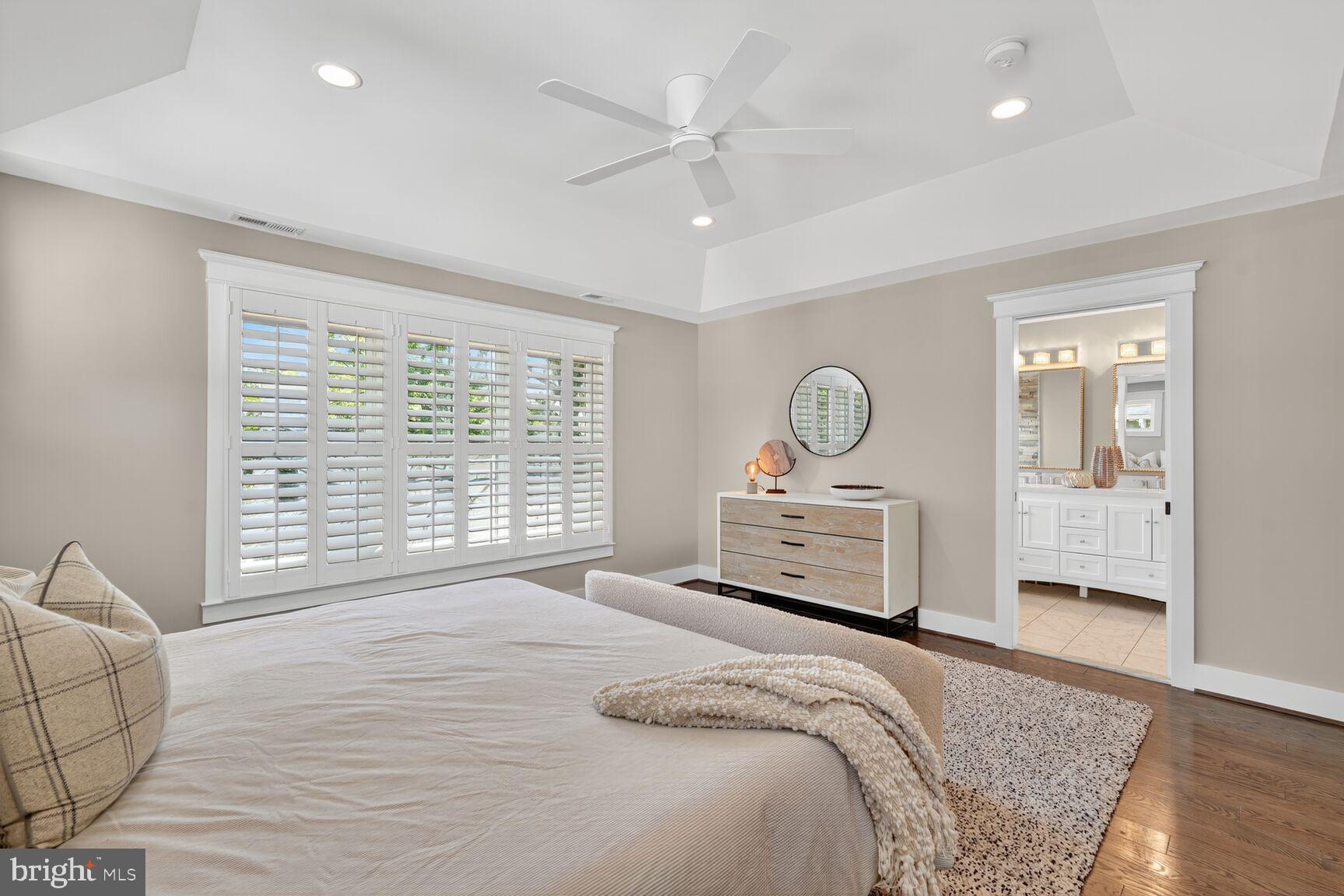 115 East Spring Street Alexandria, VA 22301 - Photo 15 of 49 a bedroom with a large bed and a chandelier