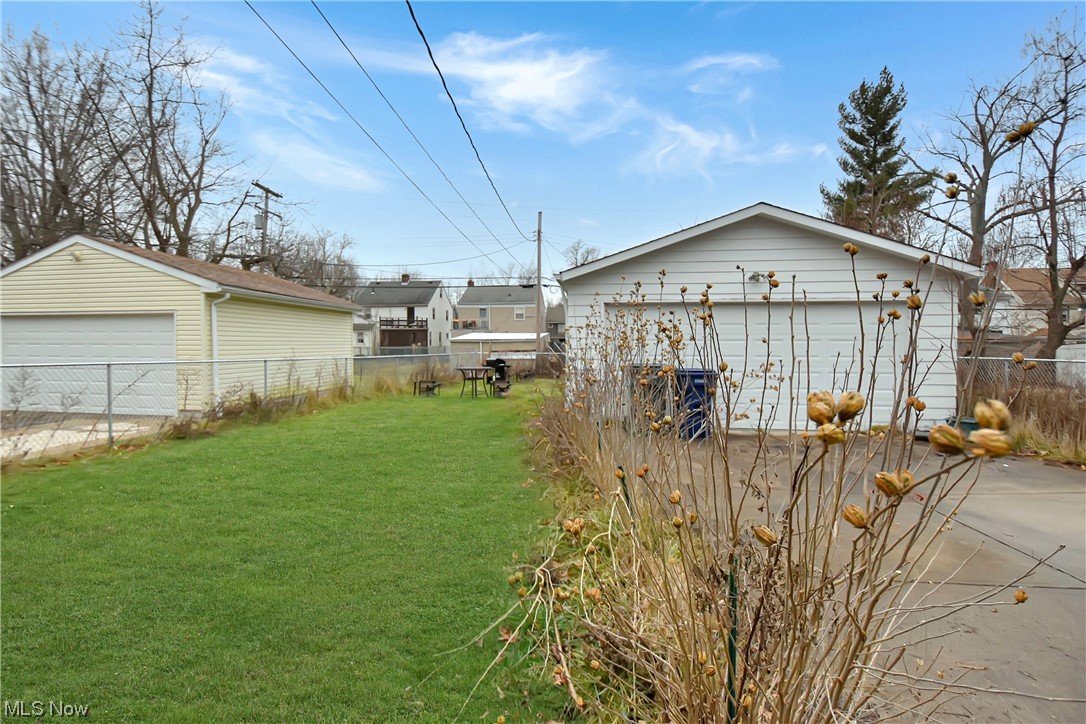 1068 Rushleigh Road Cleveland Heights, OH 44121 - Photo 20 of 22 View of yard featuring a garage