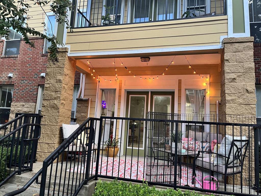 a view of a brick house with large windows