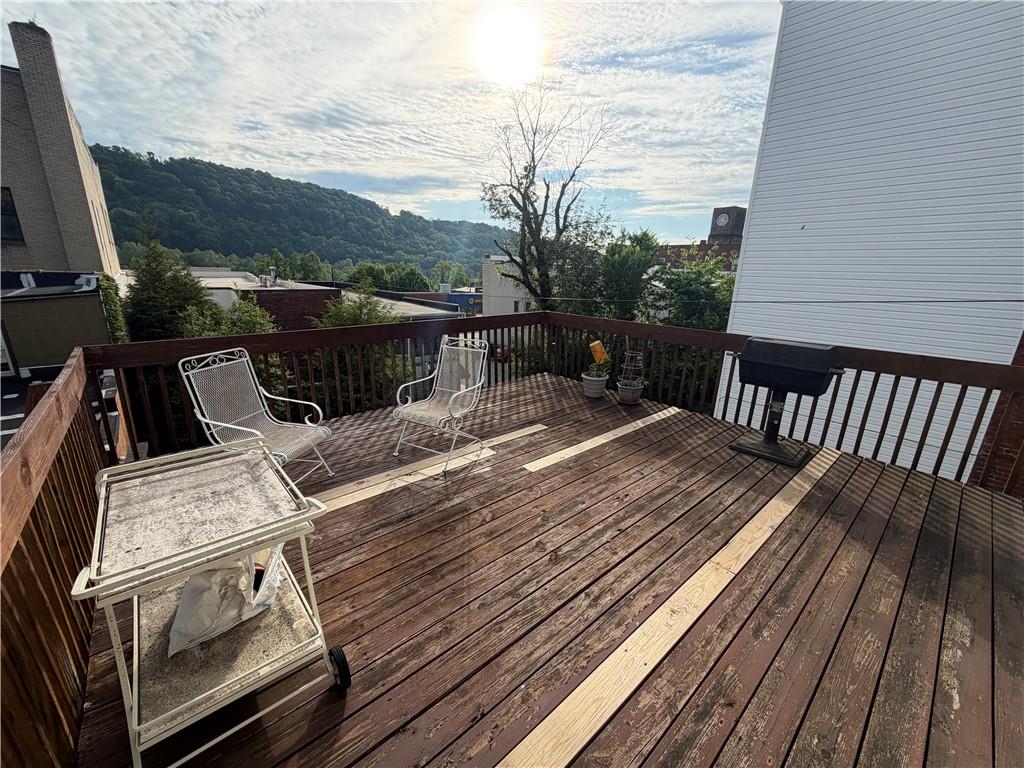 149 Chess Street Monongahela, PA 15063 - Photo 28 of 35 a view of balcony with wooden floor and outdoor seating