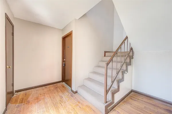 a view of entryway with wooden floor