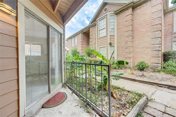 a balcony with view of outdoor space
