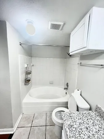 a bathroom with a bathtub and sink