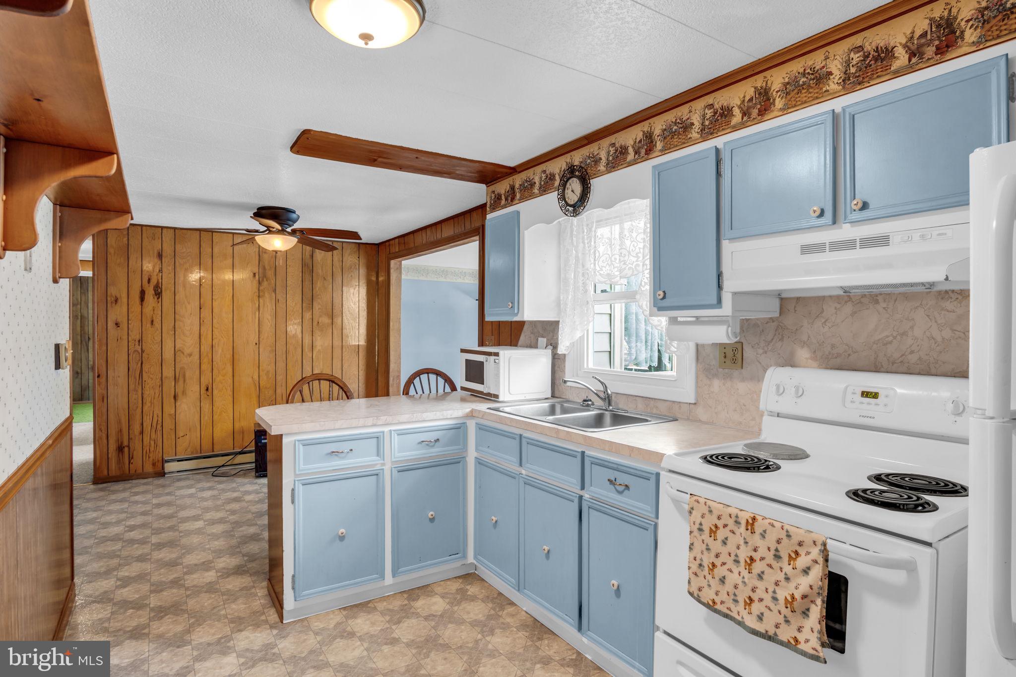 647 North Middle Road Newville, PA 17241 - Photo 11 of 35 a kitchen with a stove a sink and cabinets