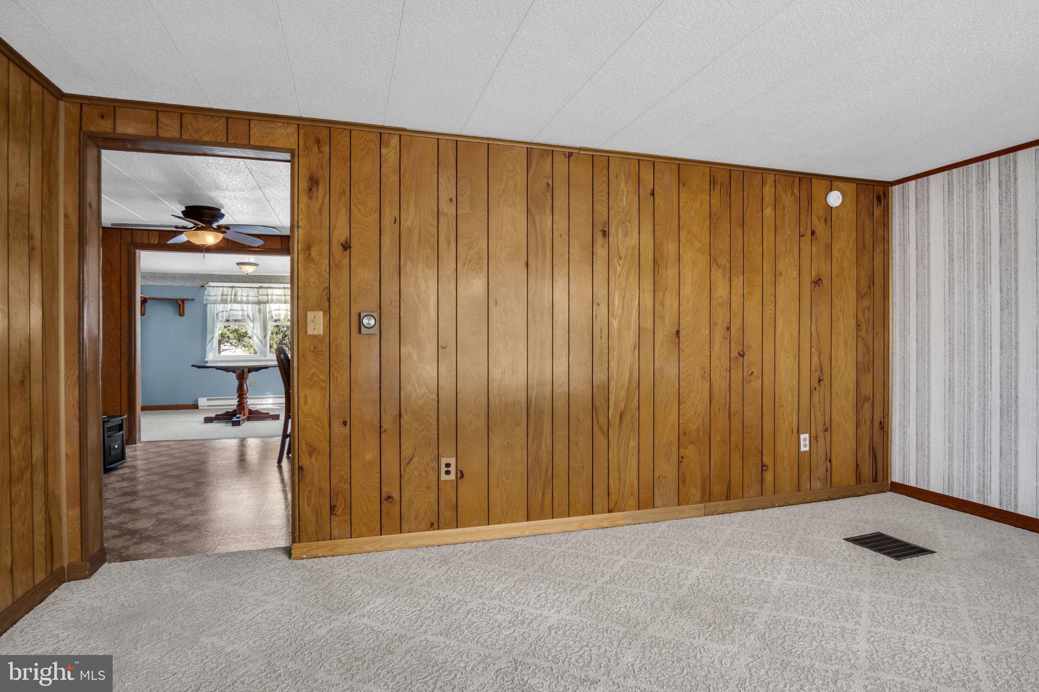 647 North Middle Road Newville, PA 17241 - Photo 3 of 35 a view of a livingroom with wooden floor and a bedroom