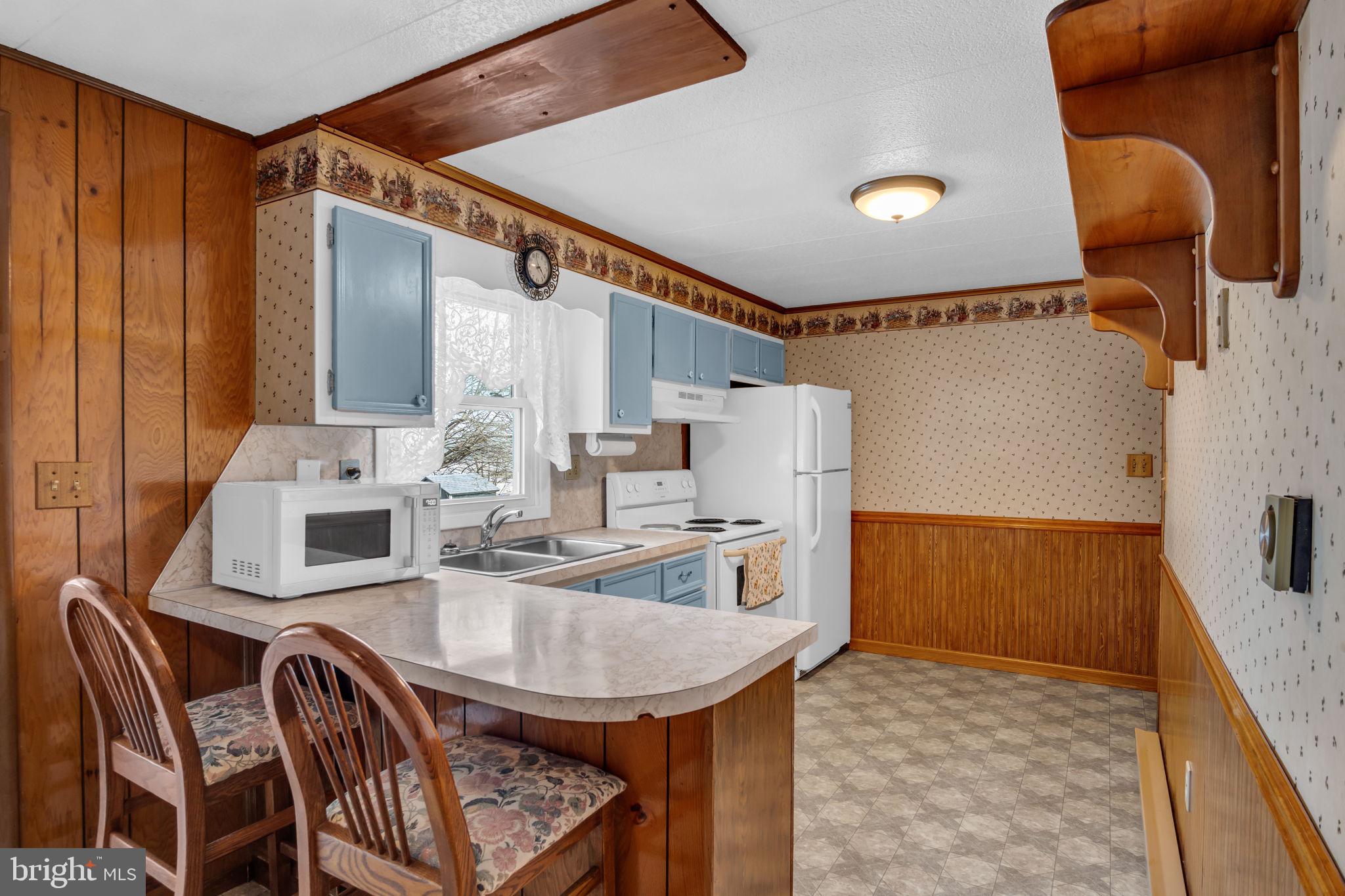 647 North Middle Road Newville, PA 17241 - Photo 10 of 35 a kitchen with stainless steel appliances granite countertop a sink and a refrigerator