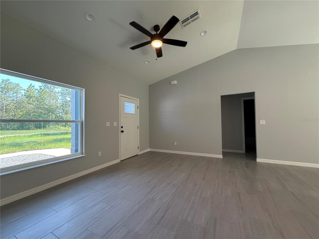 48 Locust Drive Ocala, FL 34472 - Photo 4 of 12 a view of an empty room with a window