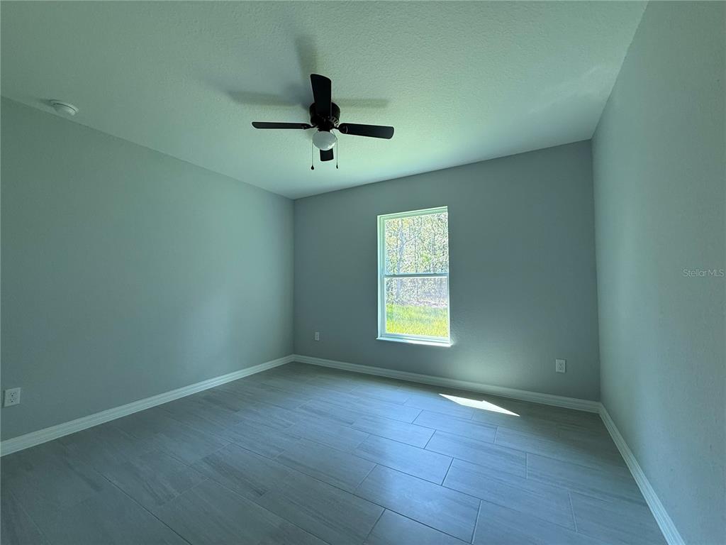 48 Locust Drive Ocala, FL 34472 - Photo 8 of 12 a view of an empty room with a window