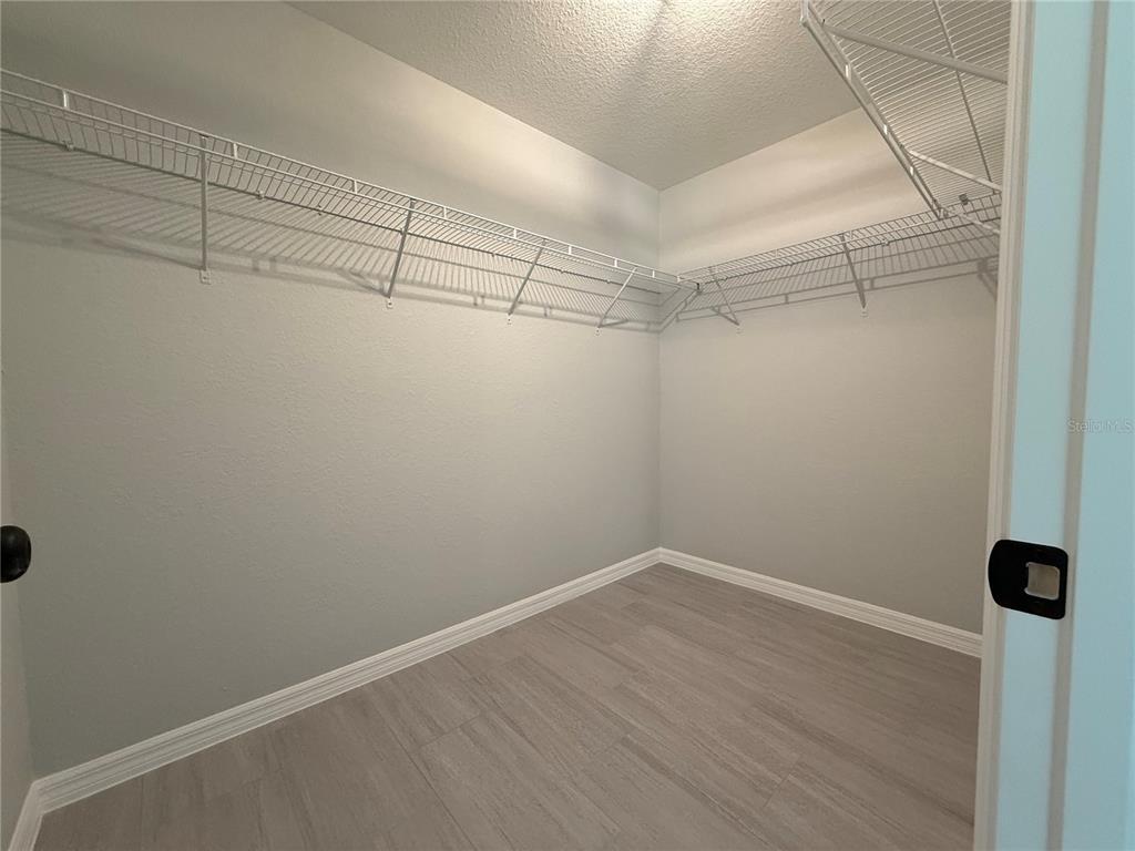 48 Locust Drive Ocala, FL 34472 - Photo 10 of 12 a view of a room with racks on the wall