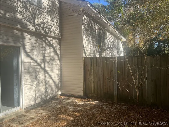 a view of backyard with green space