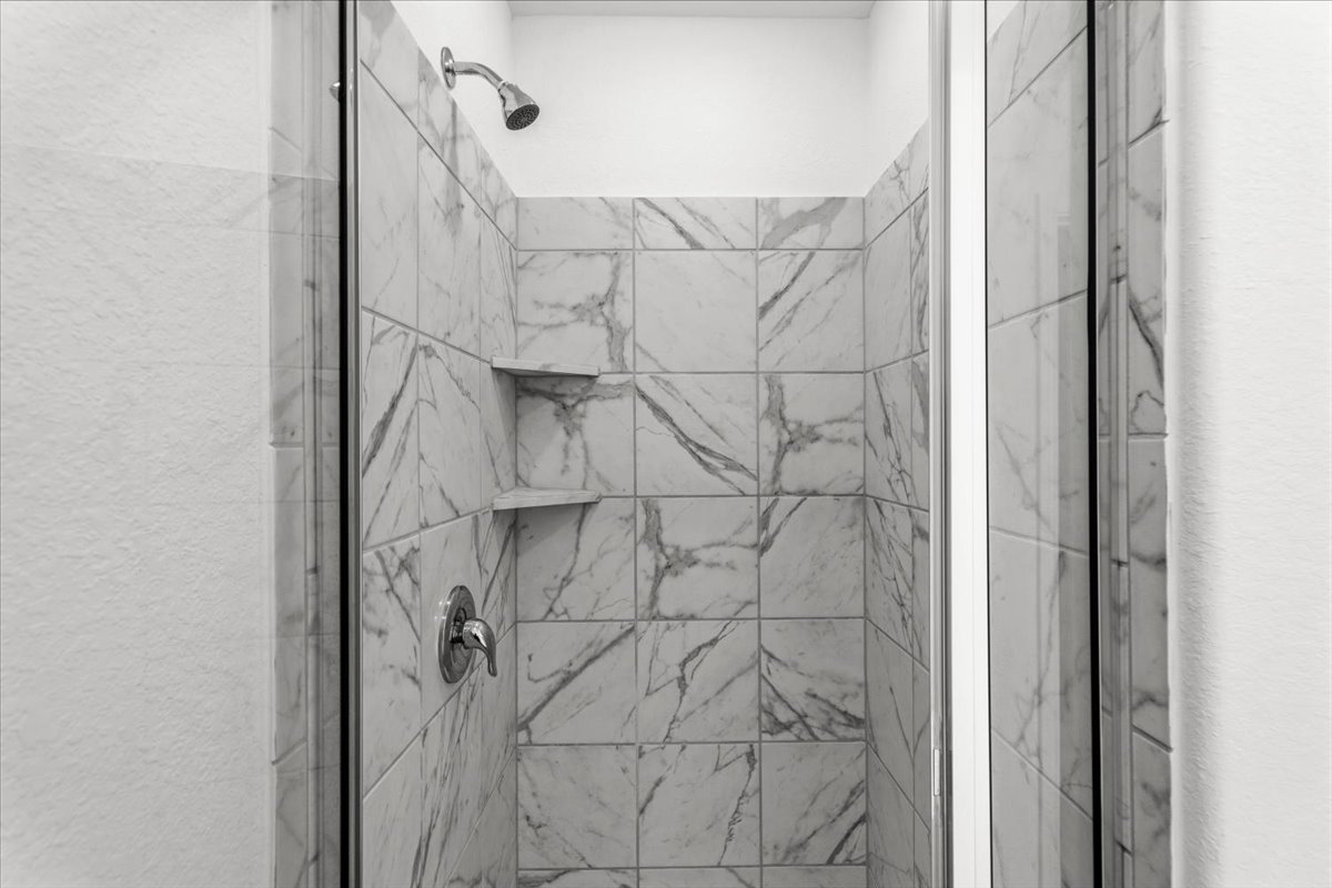167 Jeffers Kyle, TX 78640 - Photo 25 of 40 Full bathroom featuring a marble finish shower