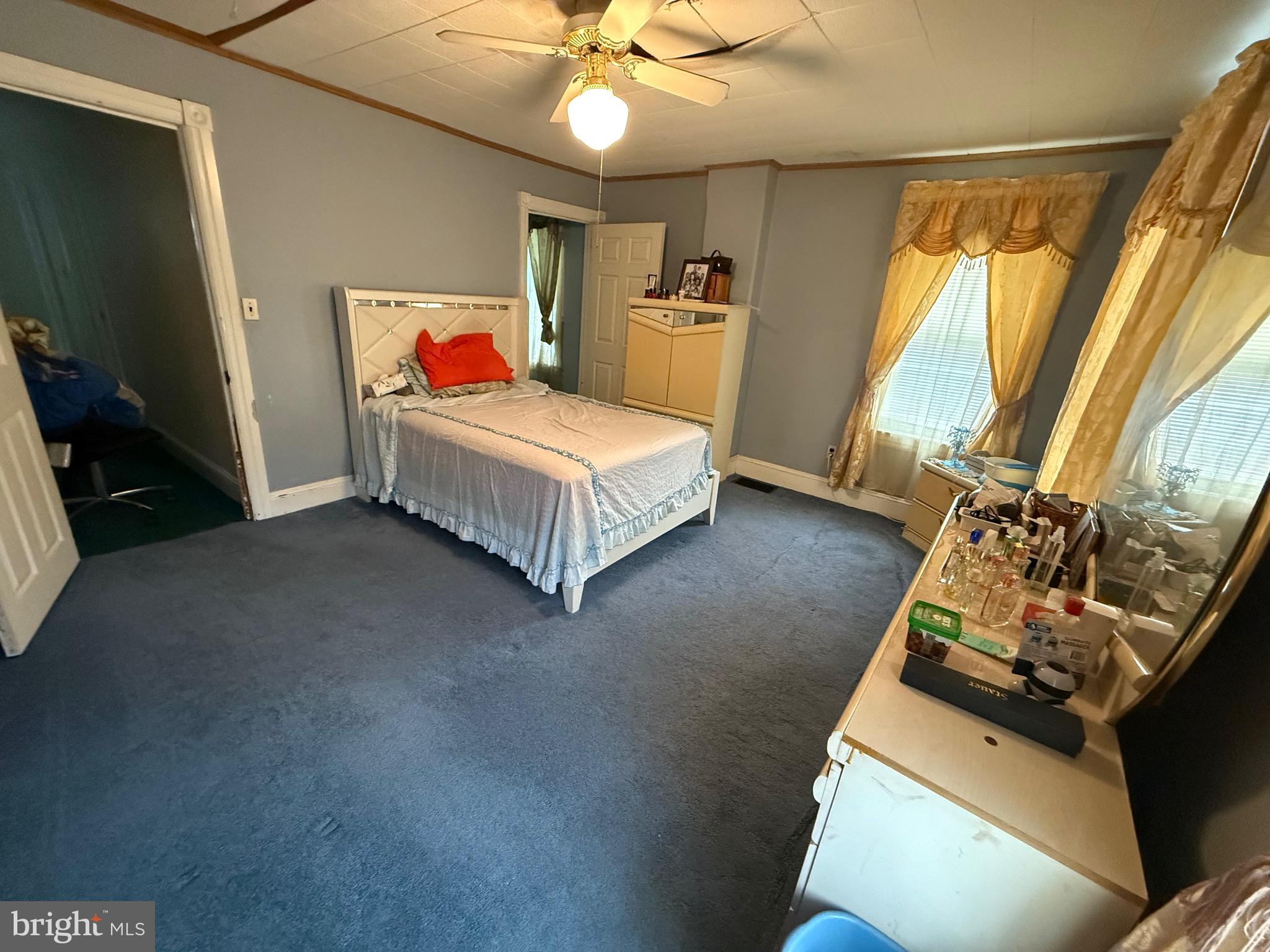 330 Fairview Road Crum Lynne, PA 19022 - Photo 12 of 30 a bedroom with a bed and a chandelier