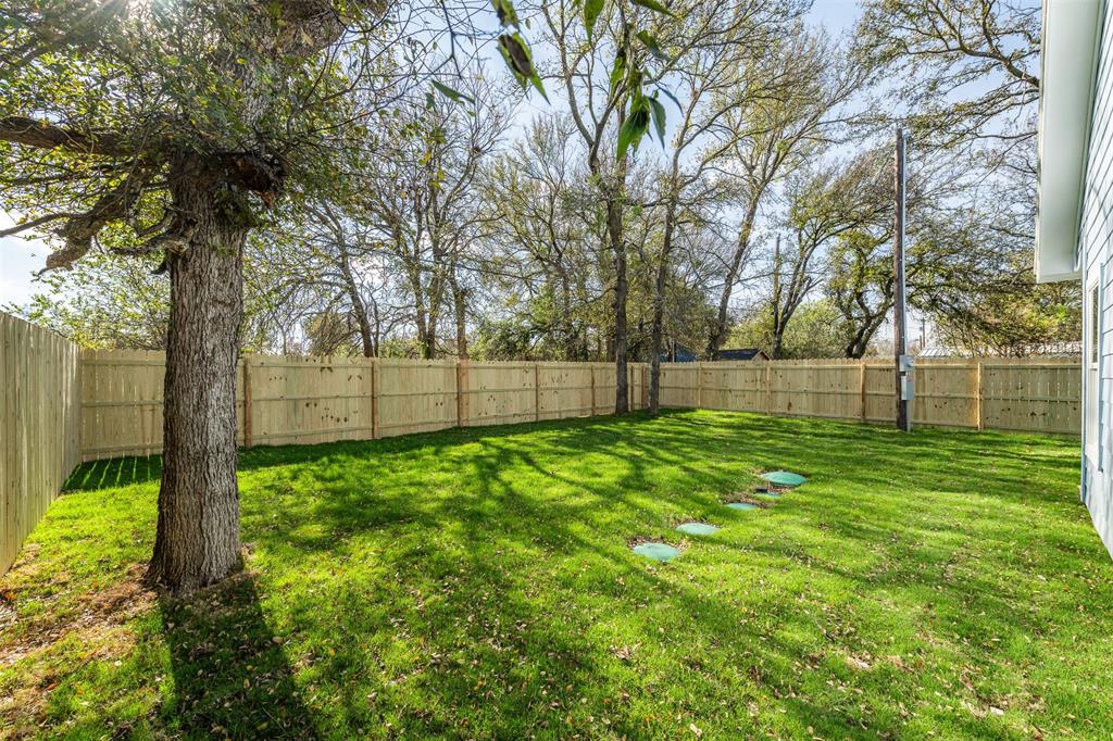 3005 Blackjack Lane Granbury, TX 76048 - Photo 13 of 30 a view of a yard with a tree