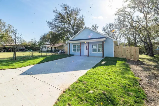 front view of a house with a yard