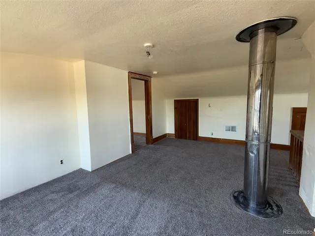 a kitchen with sink and cabinets