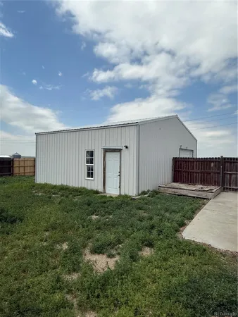 a view of a room with wooden walls
