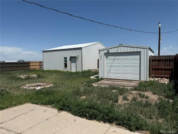 a view of a backyard of the house