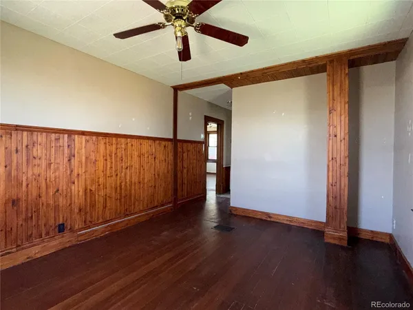 a kitchen with wooden floors and a sink