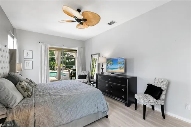 a bedroom with a bed and a cabinets