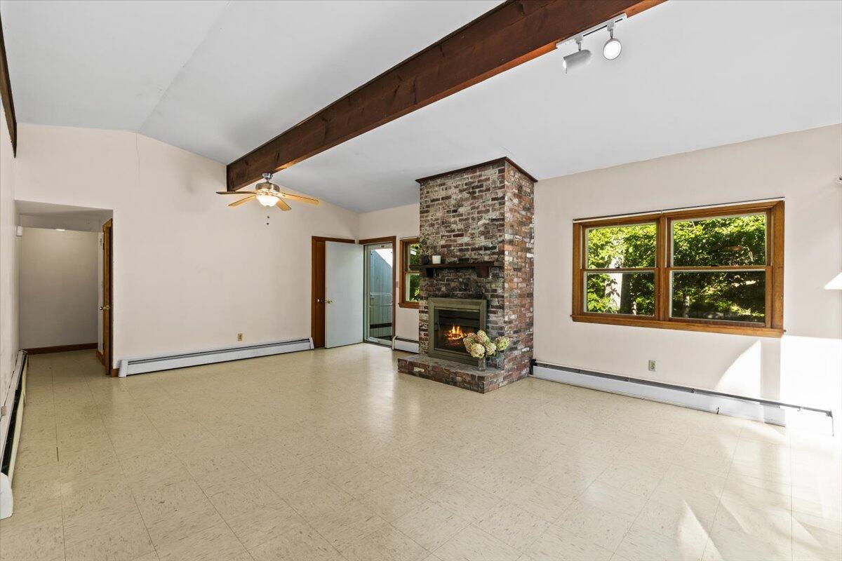 3 F R Lillie Road Woods Hole, MA 02543 - Photo 11 of 40 an empty room with furniture and large window