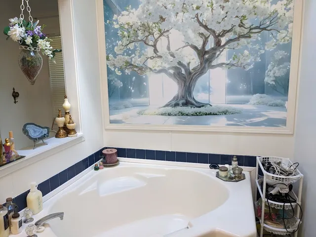 a bathroom with a granite countertop sink a mirror and shower