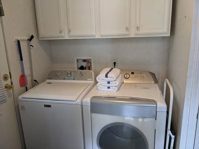 a utility room with dryer and washer