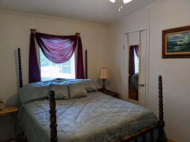 a bedroom with a bed and a closet