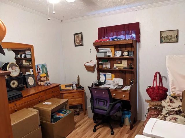 a view of a workspace with furniture