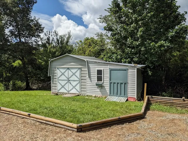 a backyard of a house with lots of green space