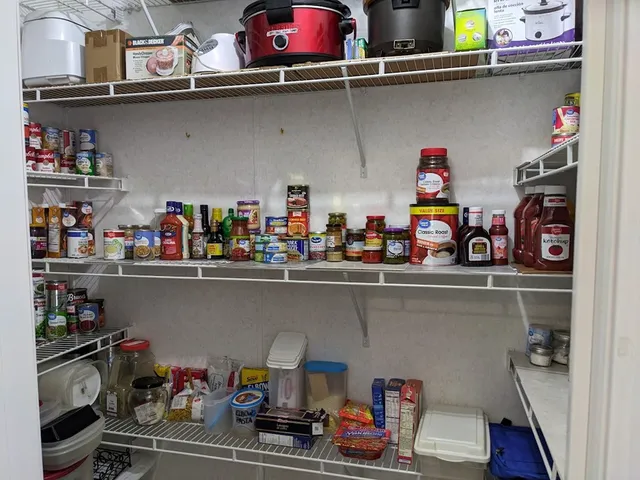 a view of storage and utility room with lots of clutter