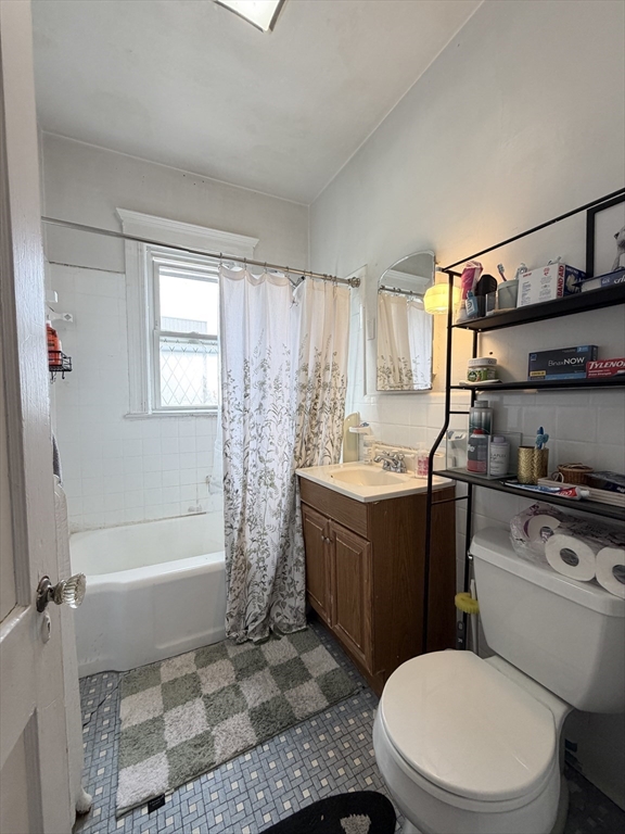 92 Wallingford Road, Unit 2 Boston, MA 02135 - Photo 14 of 14 a bathroom with a sink a toilet and shower