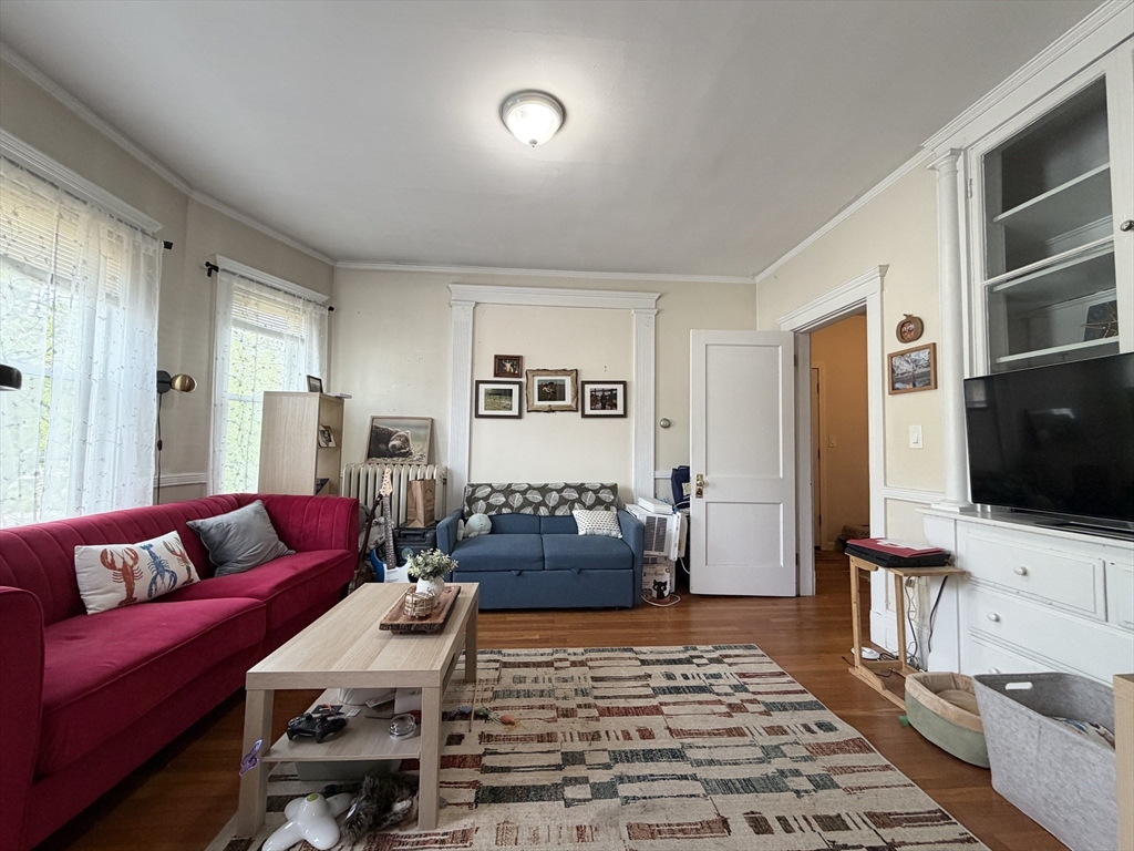 92 Wallingford Road, Unit 2 Boston, MA 02135 - Photo 2 of 14 a living room with furniture and a flat screen tv