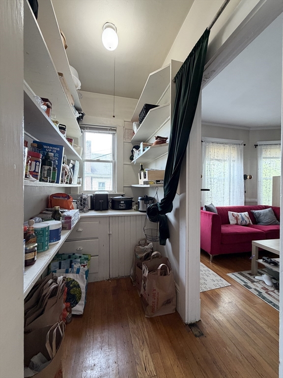 92 Wallingford Road, Unit 2 Boston, MA 02135 - Photo 3 of 14 a room with lots of furniture and wooden floor