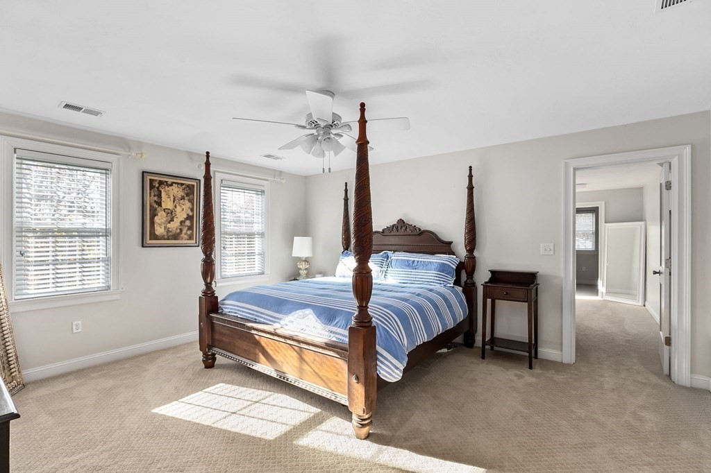 455 Broadway Hanover, MA 02339 - Photo 12 of 26 a spacious bedroom with a bed and a window