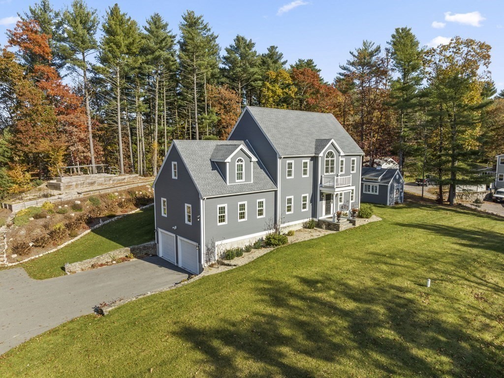 455 Broadway Hanover, MA 02339 - Photo 19 of 26 a view of a house with a yard and trees