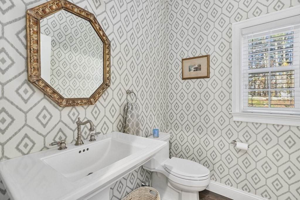455 Broadway Hanover, MA 02339 - Photo 5 of 26 a bathroom with a sink and a mirror
