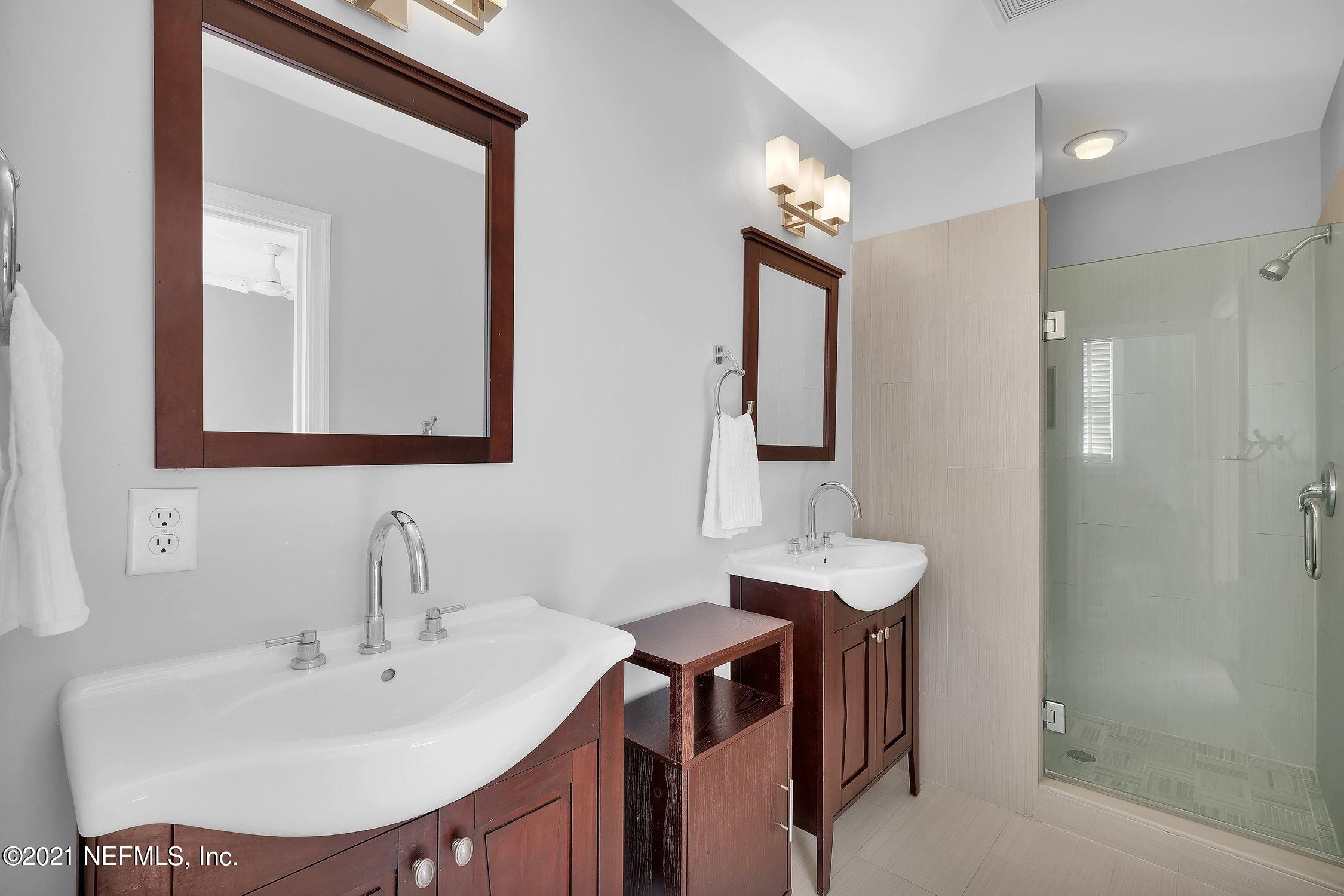 1614 Dunsford Road Jacksonville, FL 32207 - Photo 12 of 24 a bathroom with a sink and a mirror