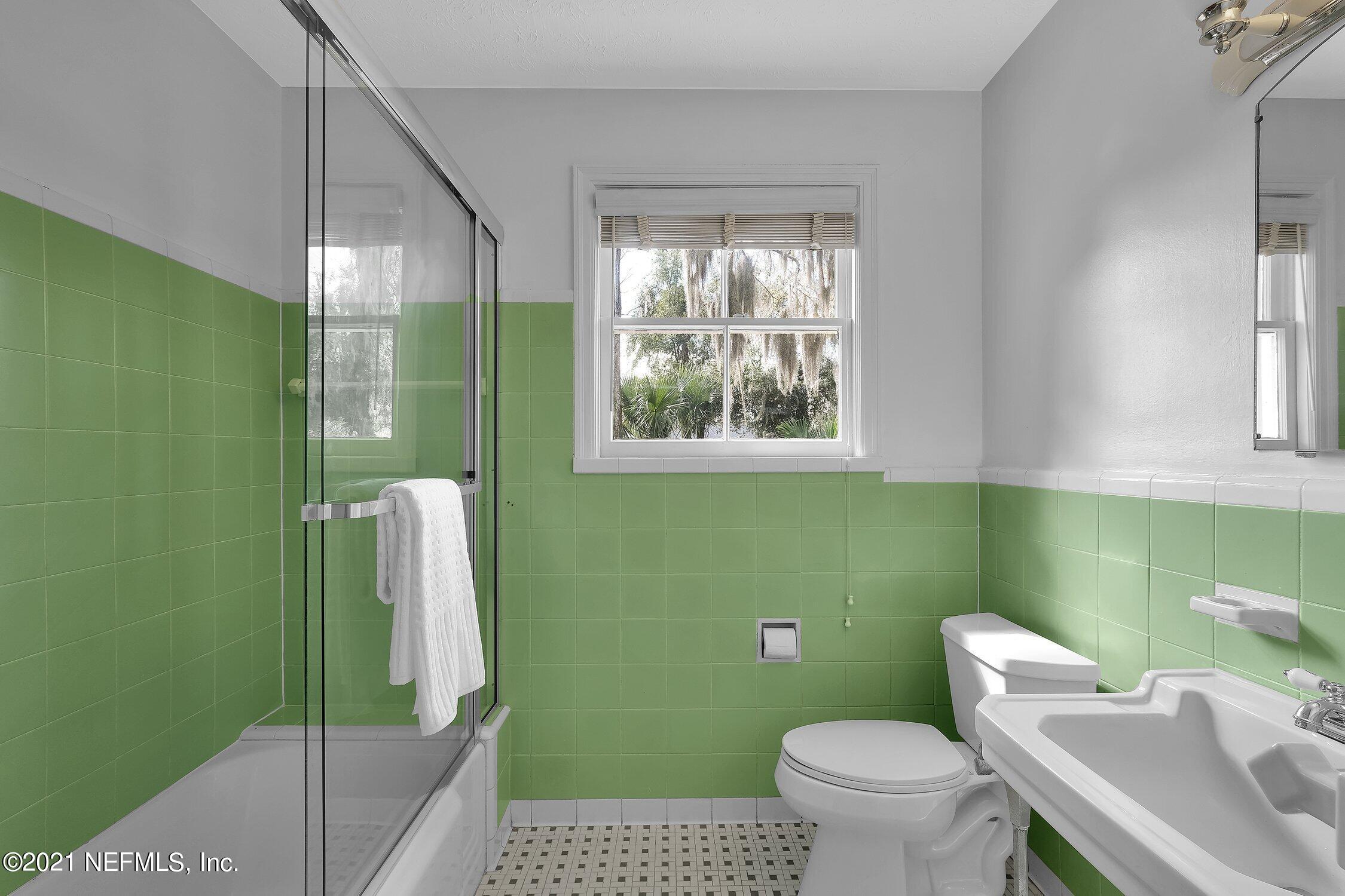 1614 Dunsford Road Jacksonville, FL 32207 - Photo 16 of 24 a bathroom with a sink a toilet and a shower