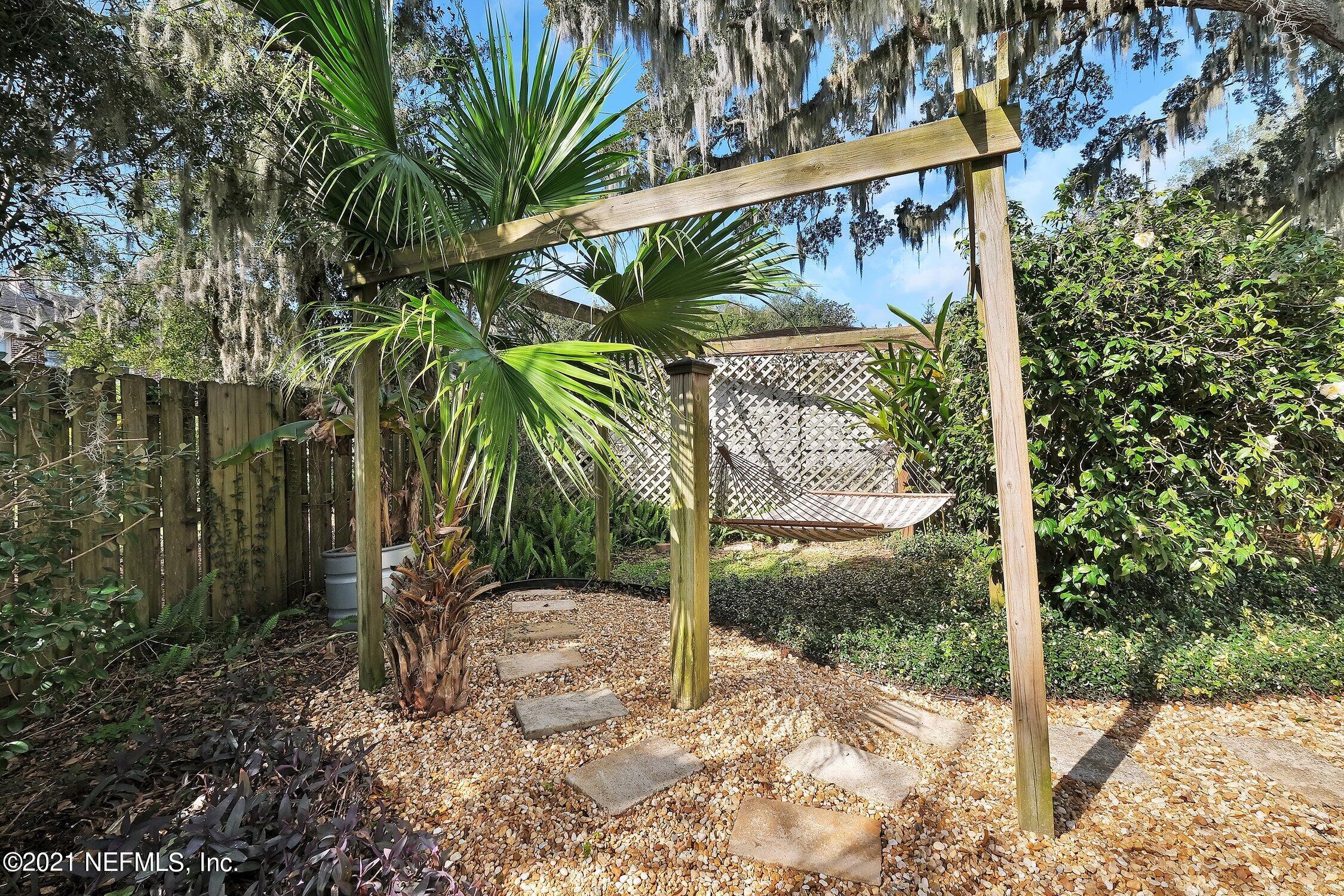 1614 Dunsford Road Jacksonville, FL 32207 - Photo 17 of 24 a view of a palm trees front of house with wooden fence