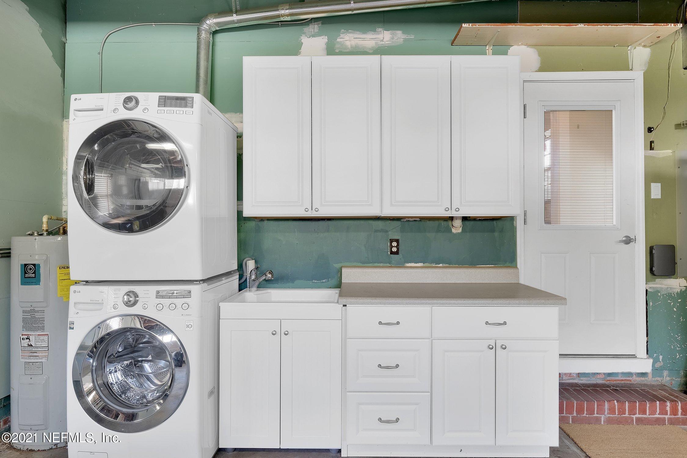 1614 Dunsford Road Jacksonville, FL 32207 - Photo 24 of 24 a utility room with sink dryer and washer