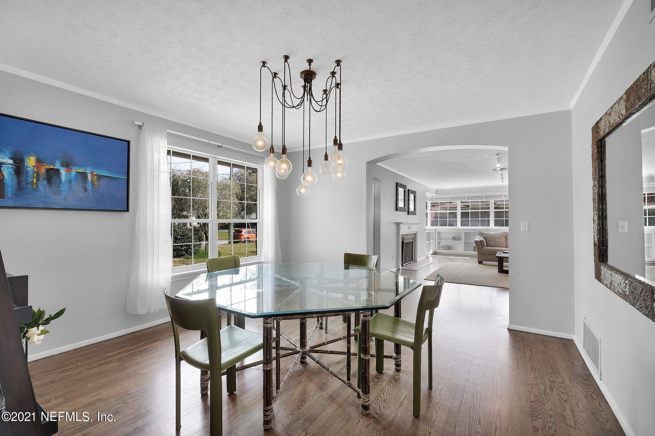 1614 Dunsford Road Jacksonville, FL 32207 - Photo 7 of 24 a view of a dining room with furniture window and wooden floor